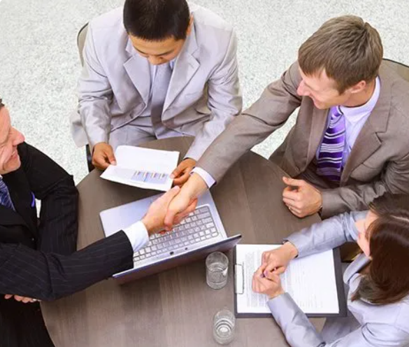 Business team meeting and shaking hands
