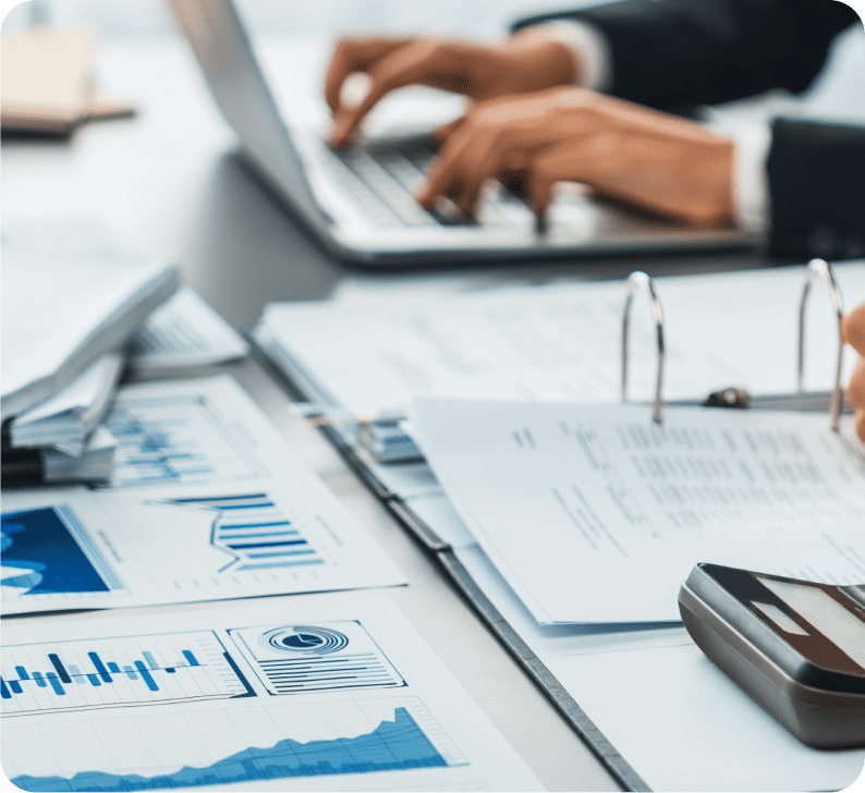 Business professionals reviewing payroll analytics and data charts